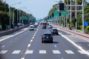 A modern highway with clear road markings, traffic lights, pedestrian crossings, and safety barriers, showing diverse drivers and pedestrians following traffic rules under bright daylight, with visible speed limit signs and road safety campaigns in the background